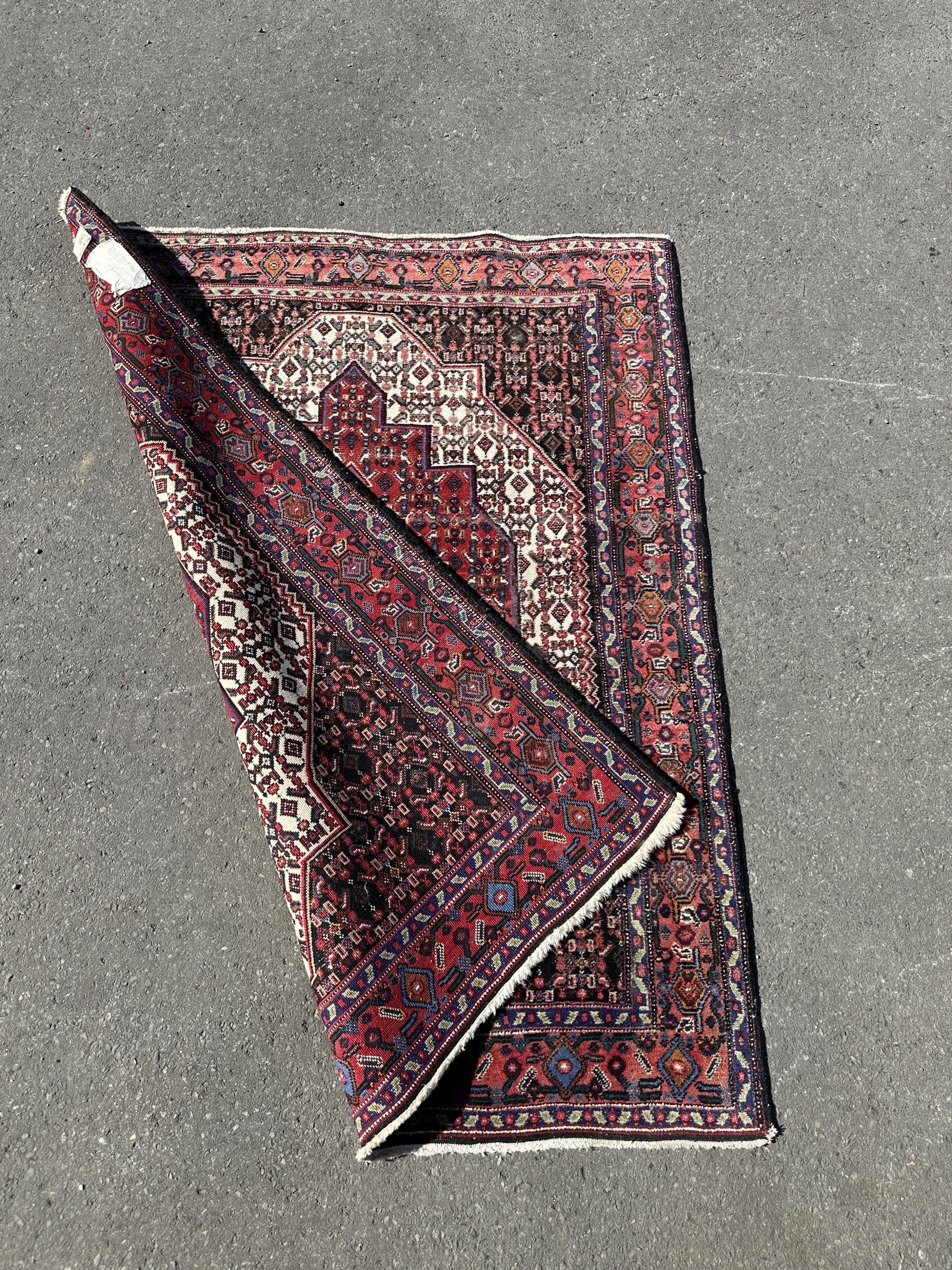 A North West Persian ivory ground rug, 158 x 126cm
